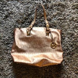 Pre-loved Mk Large Rose gold tote